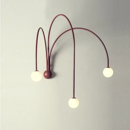 Modern burgundy iron glass led wall light with three curved metal arms and globe bulbs for living room decorbites wall light