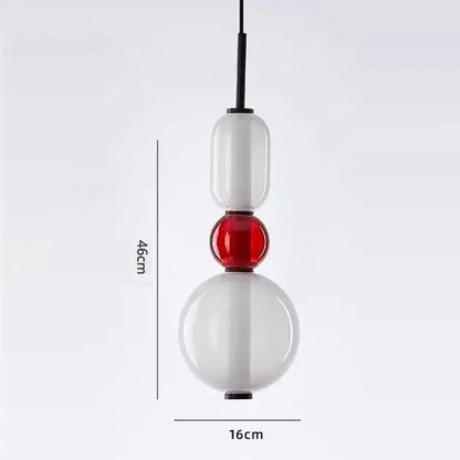 Modern candy glass ceiling hanging chandelier with stacked translucent white and red orbs suspended by black cord