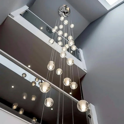 Modern cascading crystal ball led pendant light with clear glass orbs and metallic yin-yang decorbites crystal ball fixture