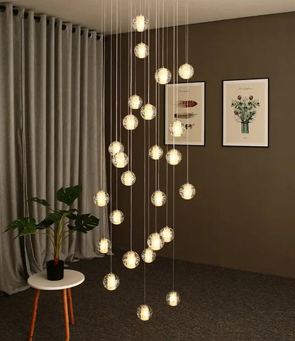 Modern cascading crystal ball led pendant light with frosted glass globes and thin metallic cords for living room decorbites pendant light