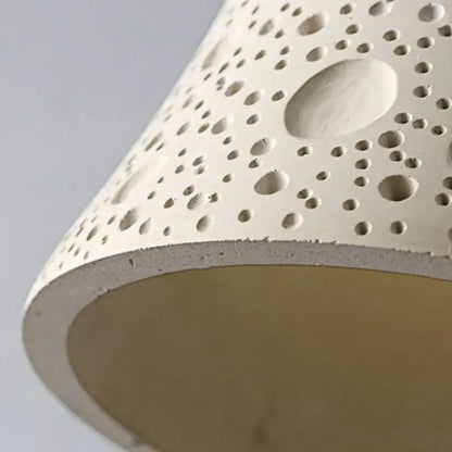 Off-white ceramic wall lamp with textured circular perforations modern bell design with pull chain switch for bedroom decorbites cement led