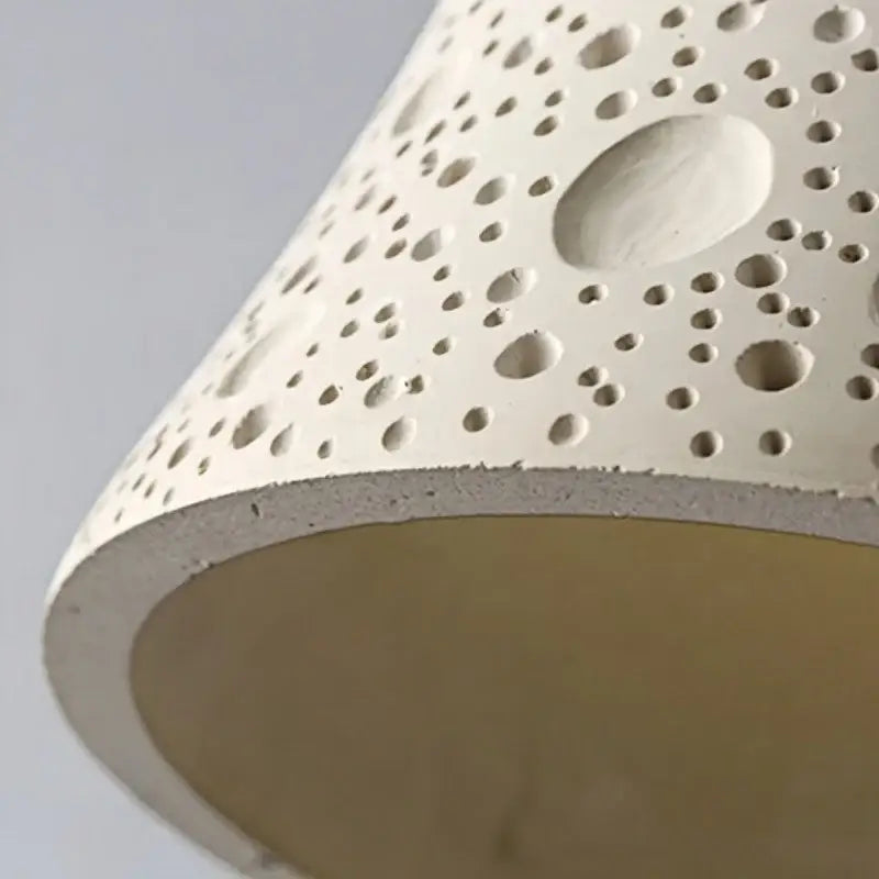 Off-white ceramic wall lamp with textured circular perforations modern bell design with pull chain switch for bedroom decorbites cement led