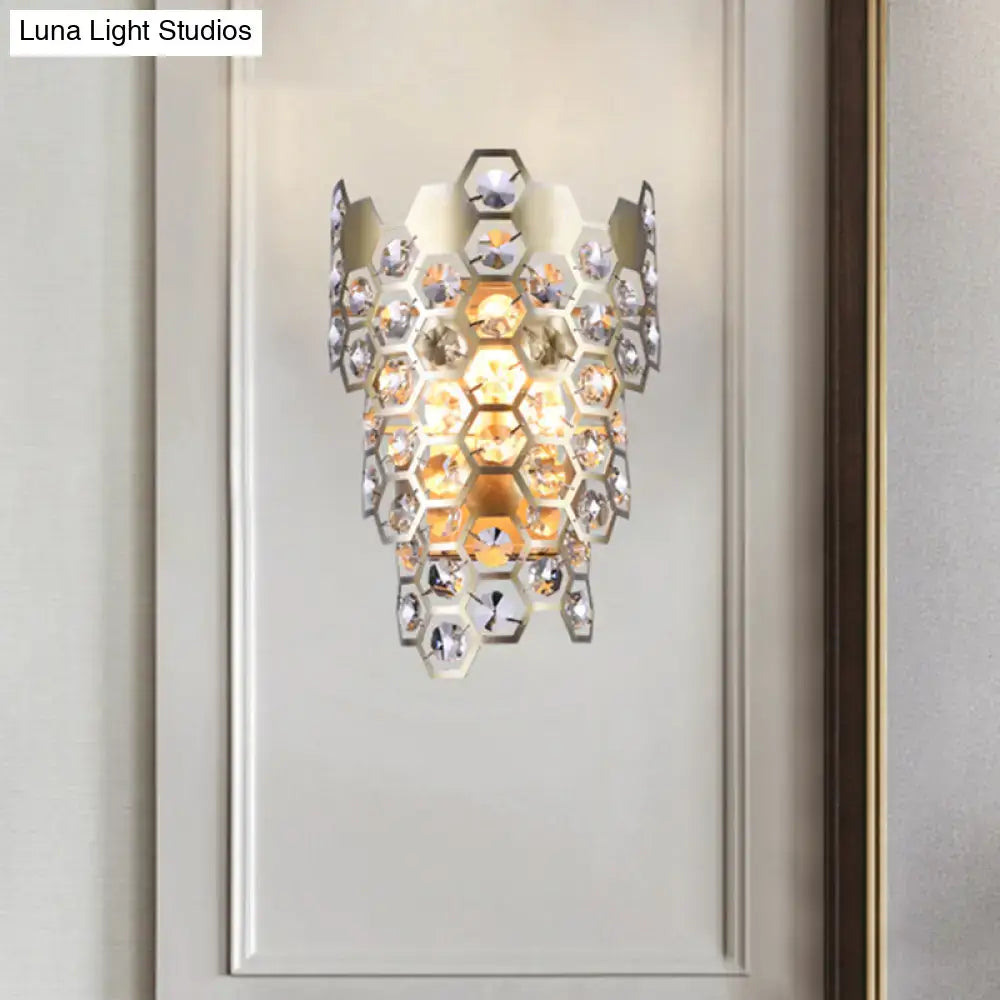 Modern champagne hexagon crystal wall sconce with cascading amber and clear crystals in a sleek metallic frame e12 light