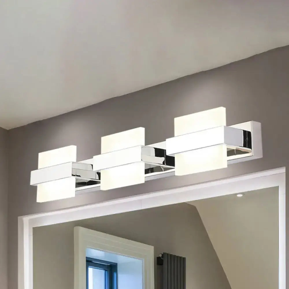 Modern chrome 3 panel acrylic vanity wall light with rectangular chrome finish and three illuminated white panels