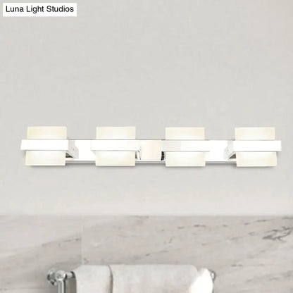 Modern chrome vanity wall light with four rectangular frosted acrylic panels for bathroom use