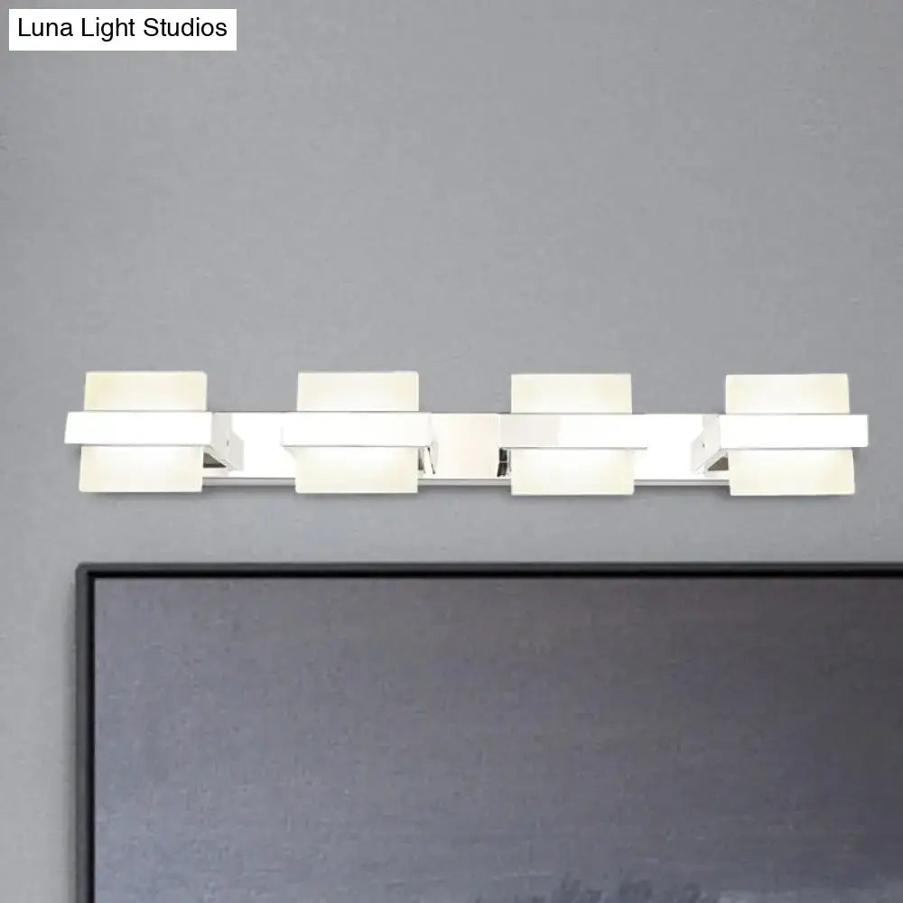 Modern white rectangular led vanity wall light with four illuminated panels for sleek bathroom vanity wall lighting