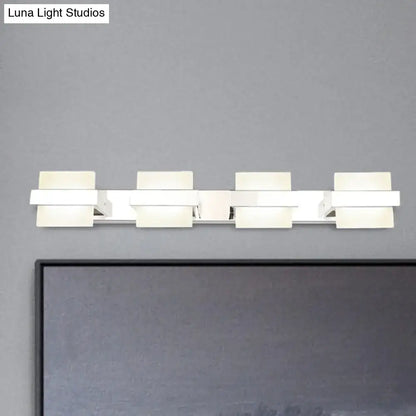Modern white rectangular led vanity wall light with four illuminated panels for sleek bathroom vanity wall lighting