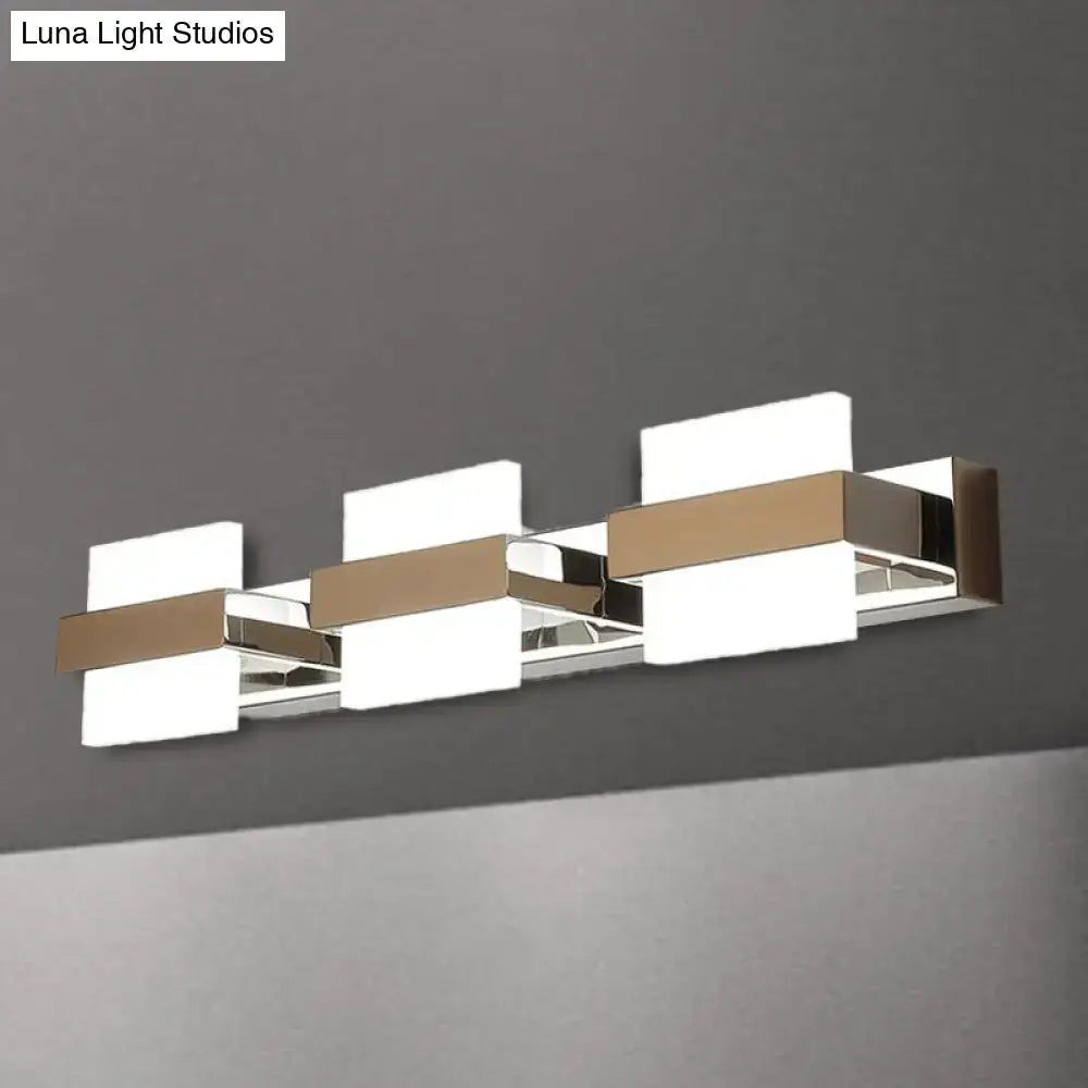 Modern chrome three-light vanity wall light with sleek chrome and brushed gold acrylic panels for bathroom use