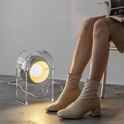 Modern chrome acrylic led desk lamp with circular transparent housing and warm yellow light ideal for desk lamp decorbites acrylic led