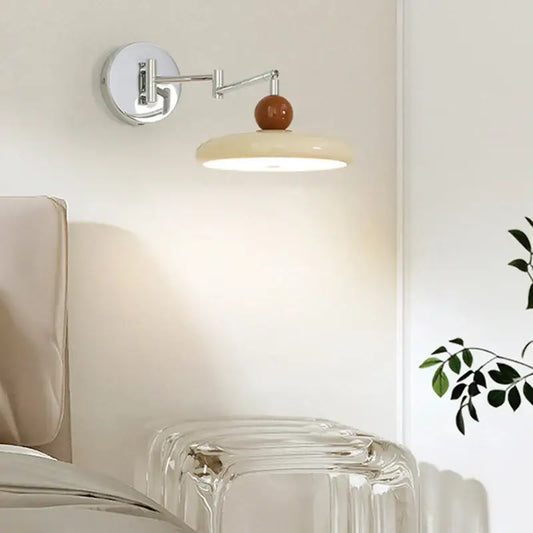 Modern chrome and ceramic iron wall light with adjustable polished chrome arm and warm ceramic sphere shade for bedroom decor