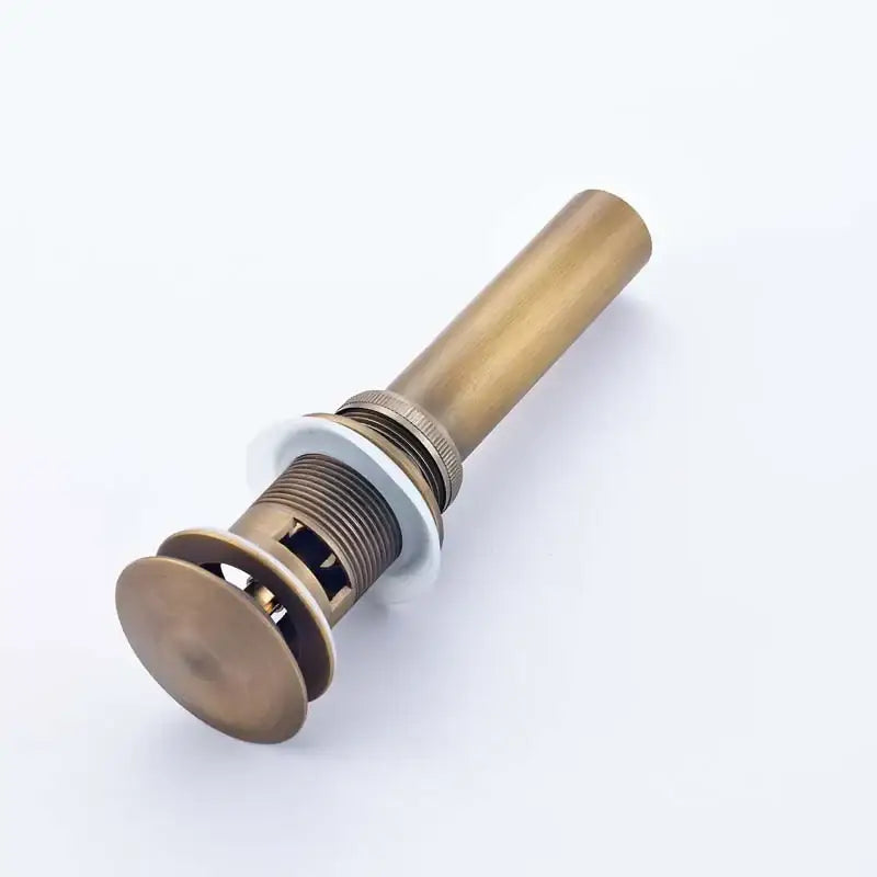 Antique brass bathroom sink pop drain with threaded stem and circular flange for modern chrome and gold sink pop stopper