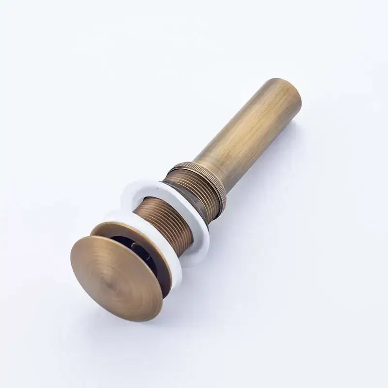 Antique brass bathroom sink pop with white ceramic flange and threaded metal body for modern chrome and gold bathroom sink stopper