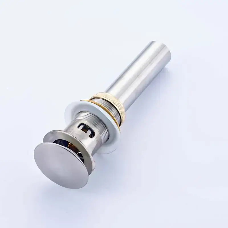 Modern chrome and gold bathroom sink pop up drain stopper with shiny chrome finish and brass threaded collar