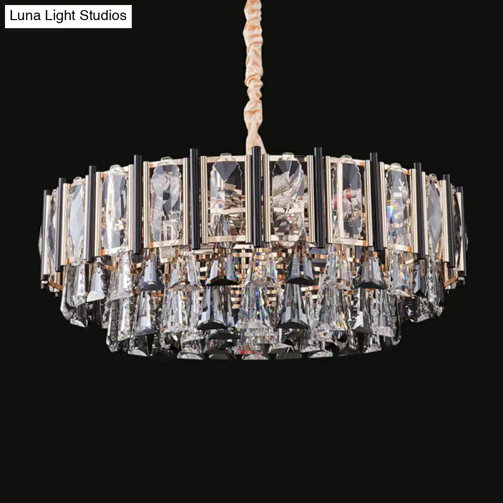 A modern DecorBites™ crystal chandelier with gold and black frame and clear tiered crystals featuring adjustable chain cord length