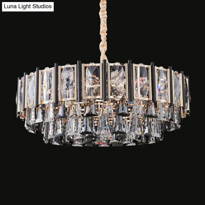 A modern DecorBites™ crystal chandelier with gold and black frame and clear tiered crystals featuring adjustable chain cord length