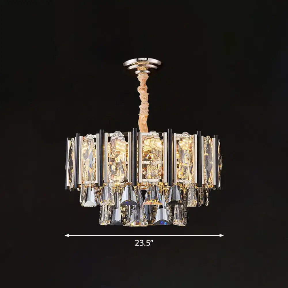 A modern clear beveled crystal chandelier with polished chrome finish featuring layered rectangular and teardrop crystals with adjustable chain cord length