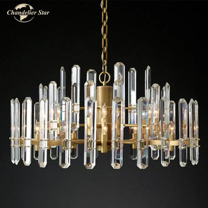 Brass-finished chandelier with clear crystal prisms and candle-style bulbs in modern chrome black metal decorbites brass chrome design