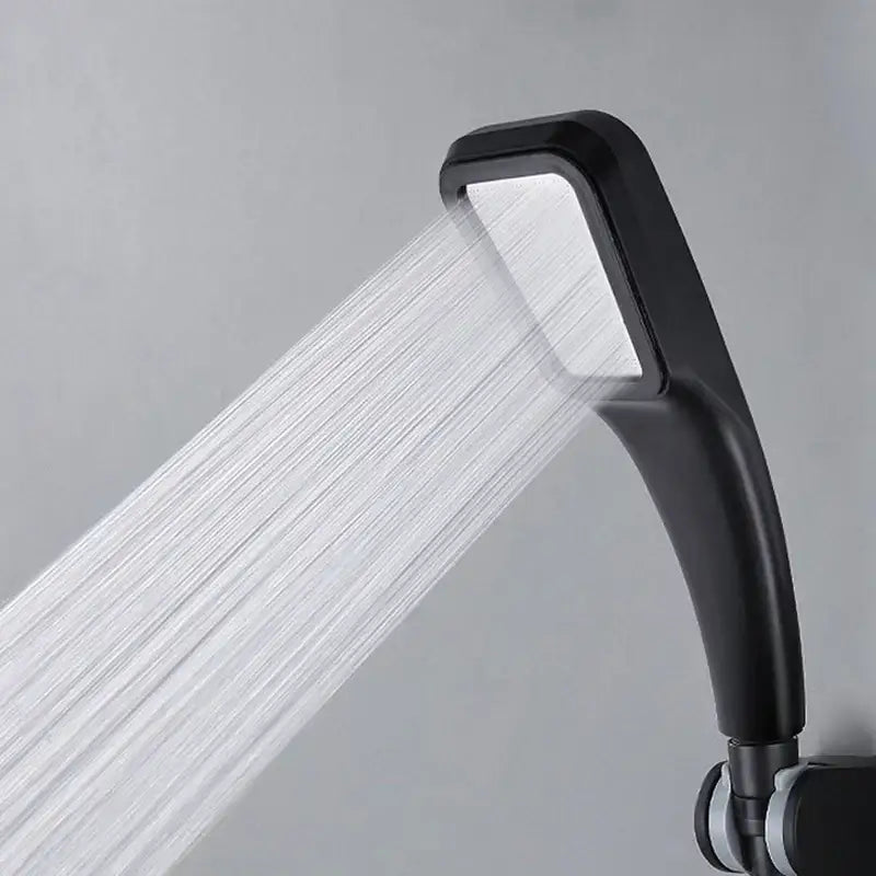 Black handheld rainfall shower head with sleek curved design and rectangular spray face for modern bathroom use