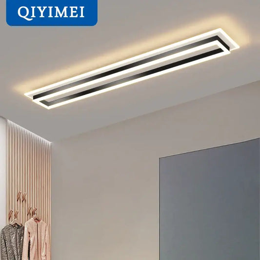Modern chrome and black rectangular dimmable led chandelier with sleek frame emitting warm white light for living room