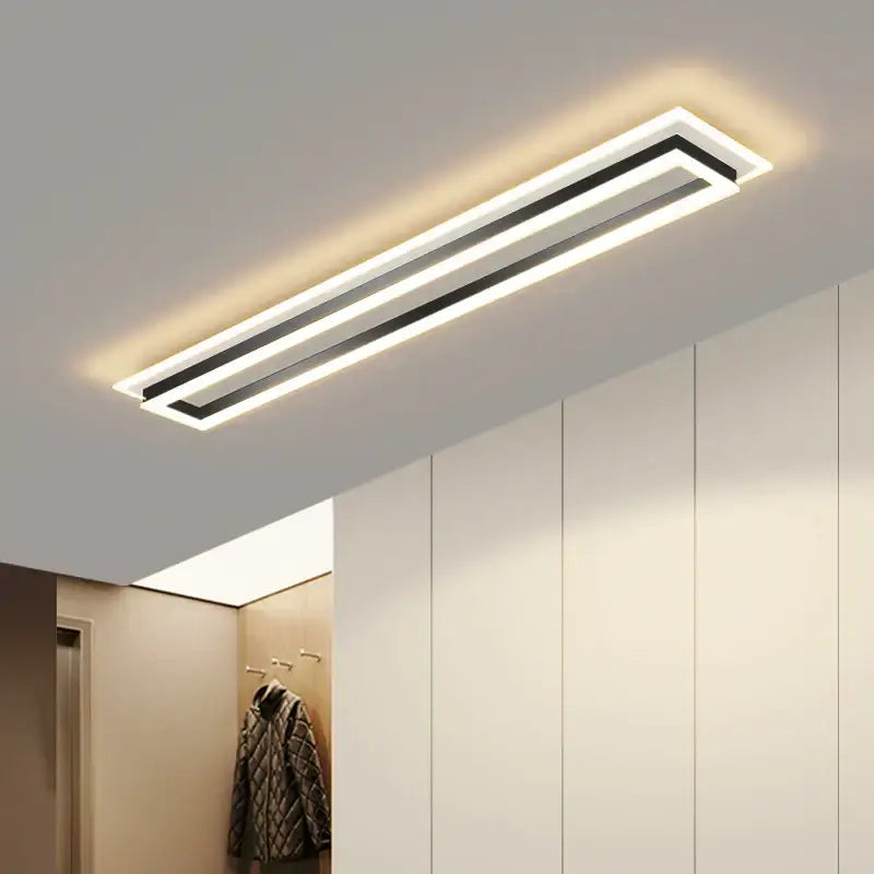Modern chrome and black rectangular dimmable led chandelier with sleek white frame and warm ambient glow decorbites dimmable led