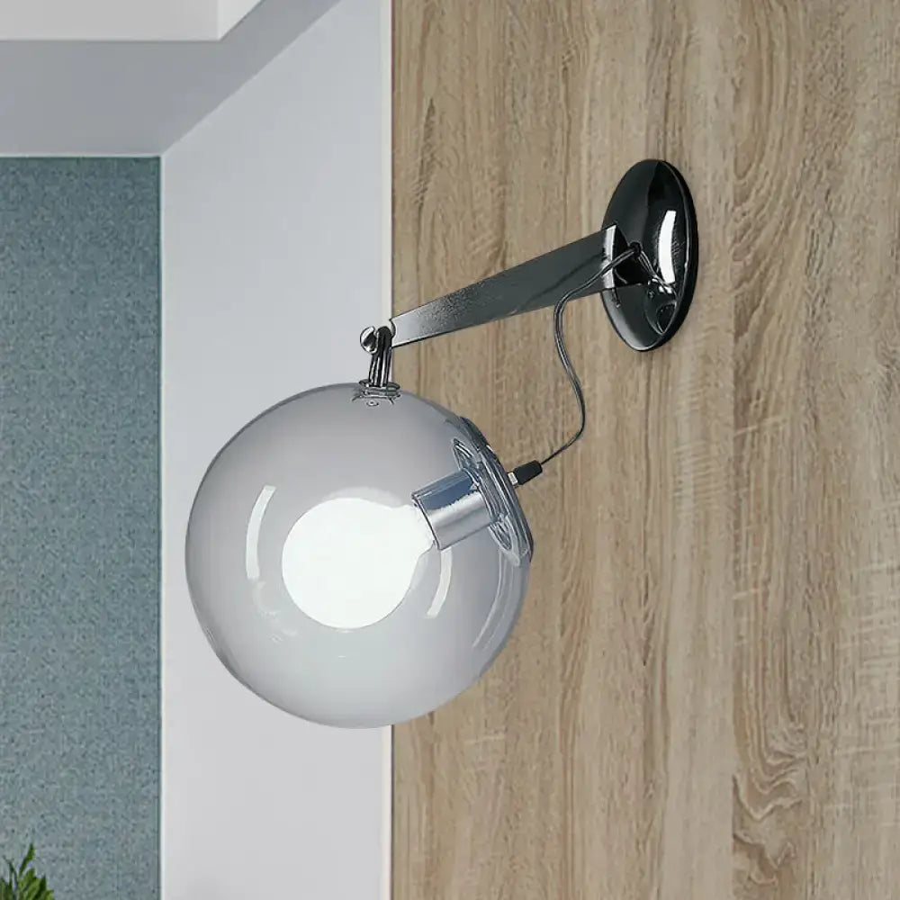 Modern chrome clear glass bubble wall sconce with adjustable arm and translucent spherical shade for bedroom lighting