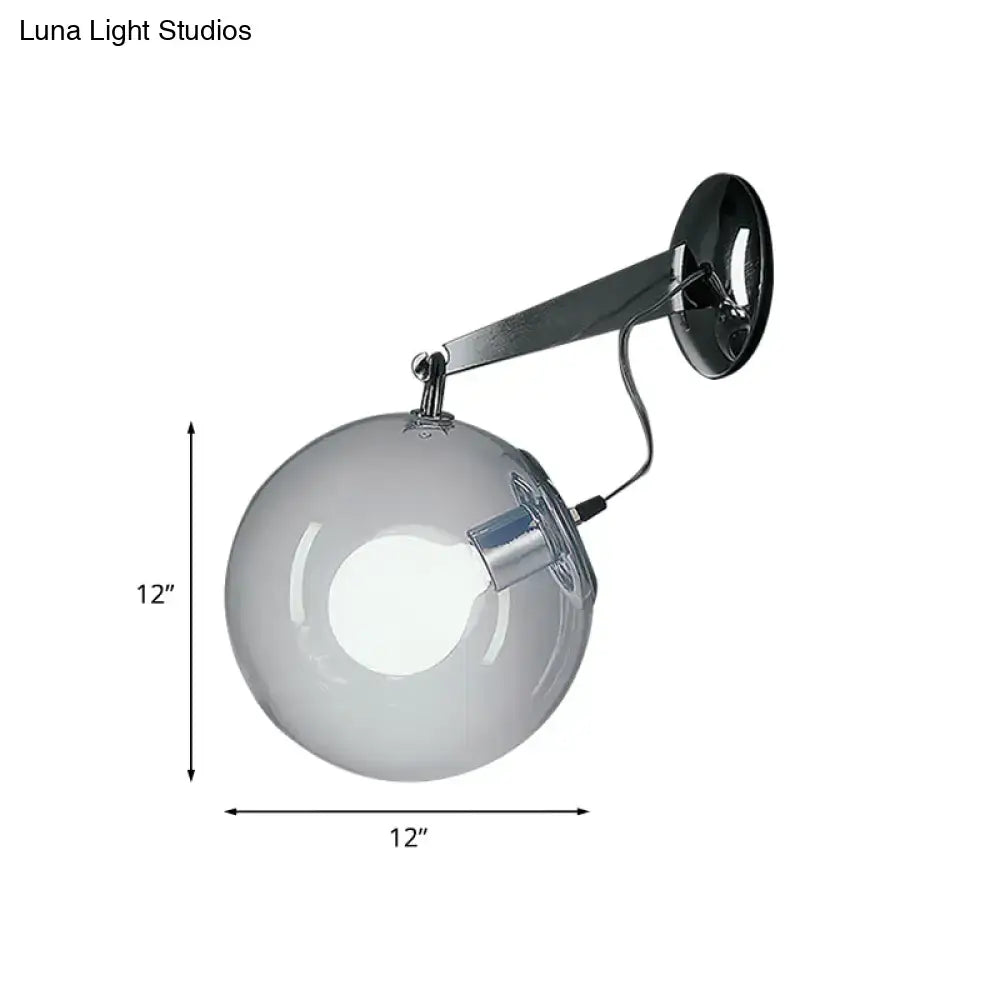 Modern chrome clear glass bubble wall sconce with a 12-inch glass bubble and polished chrome arm for bedroom lighting