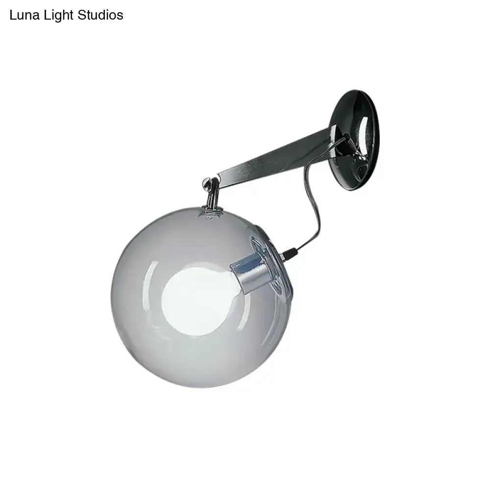 Modern chrome clear glass bubble wall sconce with translucent gray glass bubble and adjustable polished chrome arm for bedroom use