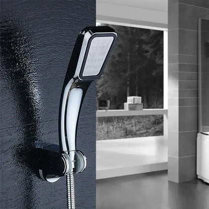 Modern chrome contemporary shower head with sleek curved design and multiple spray nozzles for pressure boost