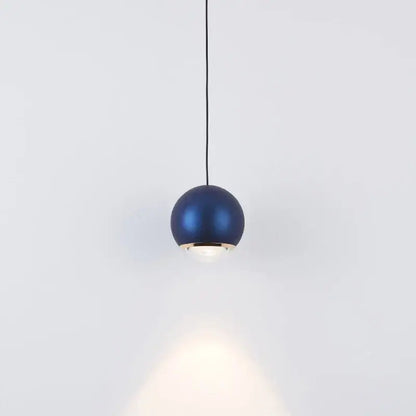 Modern chrome and copper ball pendant light featuring a sleek blue matte finish with gold-toned trim for dining rooms