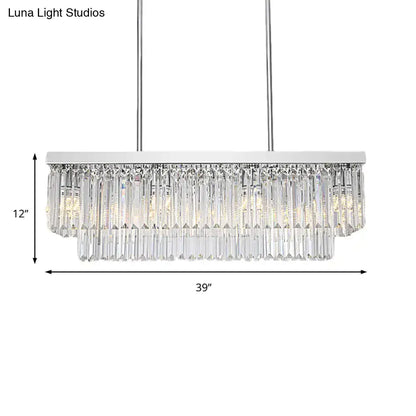 A modern chrome island light with a rectangular frame and cascading clear crystal prisms with chain cord for e12 e14 bulbs