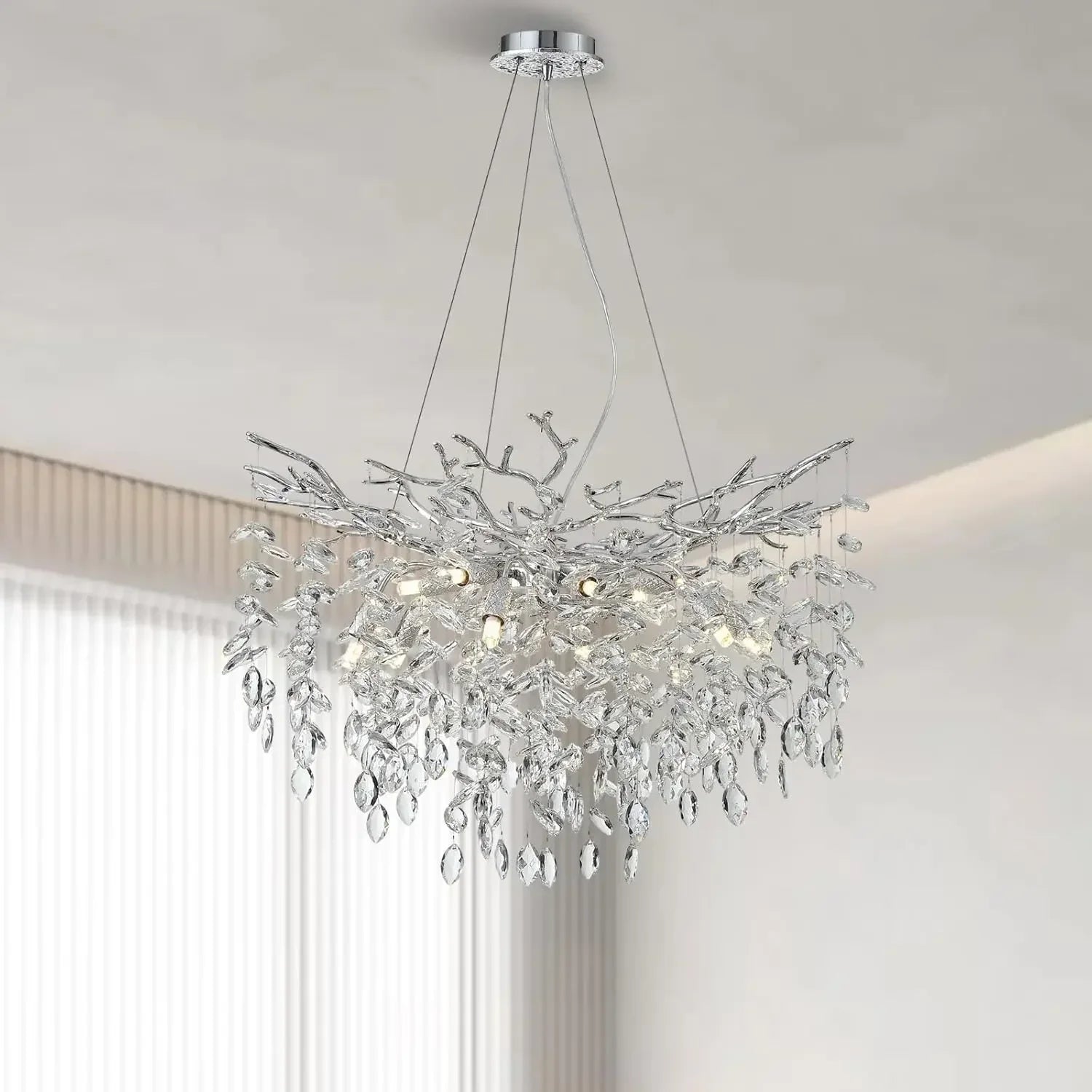 A modern chrome branch crystal chandelier with silver-toned intricate design and crystal droplets for living room bedroom