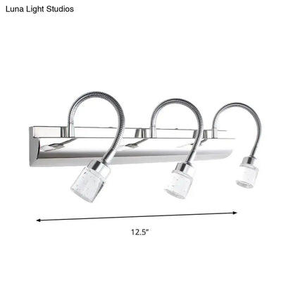 Modern chrome crystal cylinder vanity wall sconce with three clear crystal cylinder shades and flexible gooseneck arms