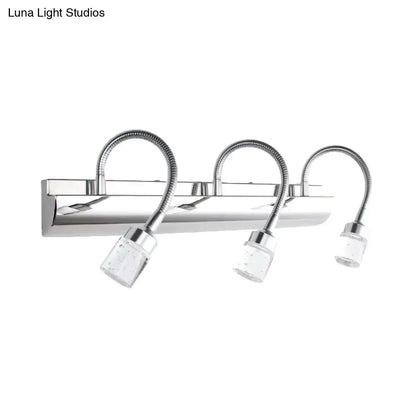 Modern chrome crystal cylinder vanity wall sconce with three clear crystal cylinder shades and flexible gooseneck arms