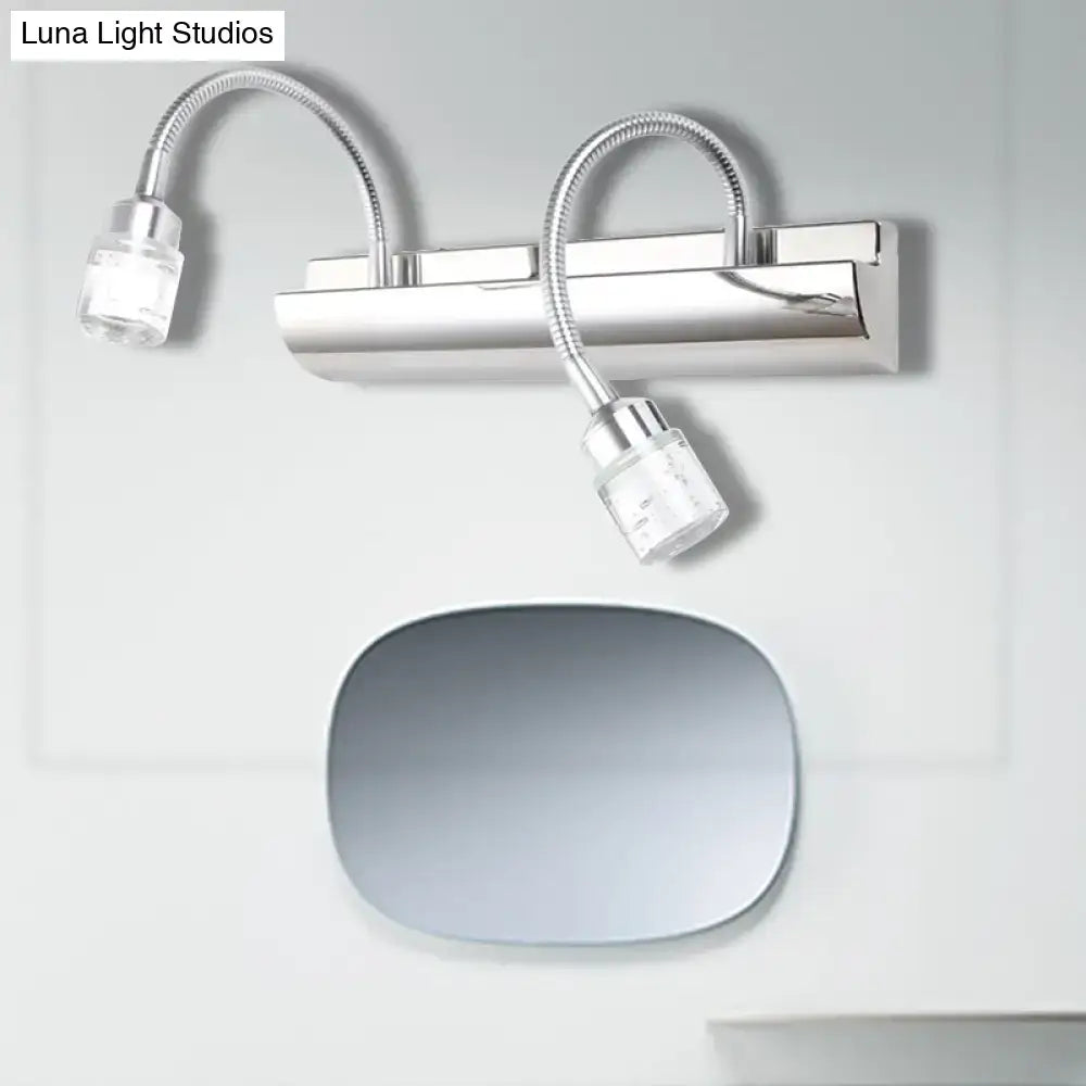 Modern chrome crystal cylinder wall sconce with two flexible gooseneck arms and clear glass lamp heads for reading