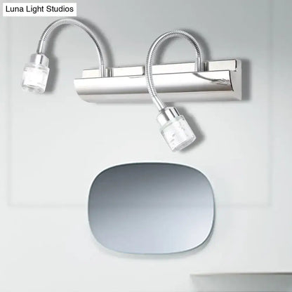Modern chrome crystal cylinder wall sconce with two flexible gooseneck arms and clear glass lamp heads for reading