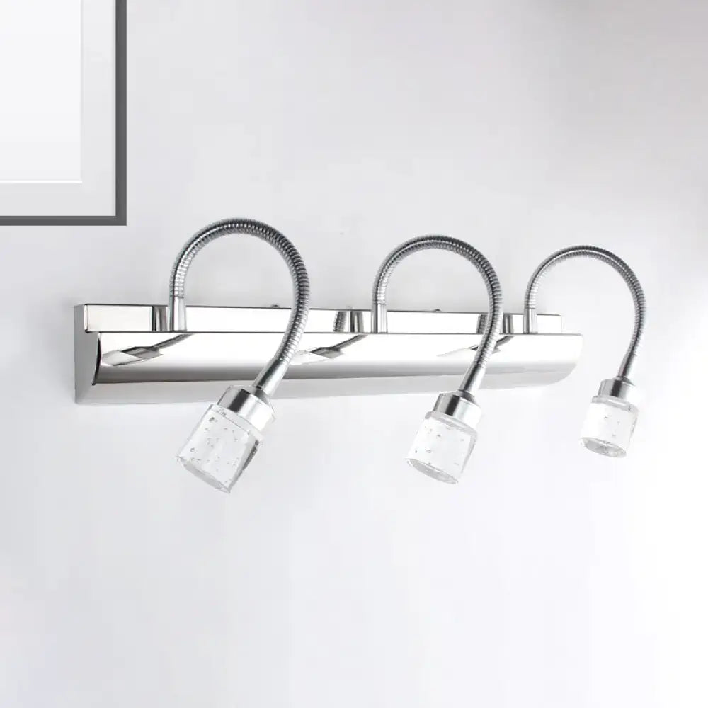 Modern chrome crystal cylinder vanity wall sconce with three flexible gooseneck arms and clear crystal cylinder diffusers