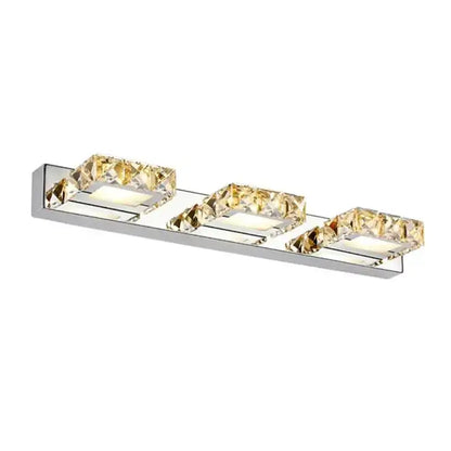 Modern chrome crystal led mirror light bathroom sconce with three rectangular crystal accents emitting warm glow