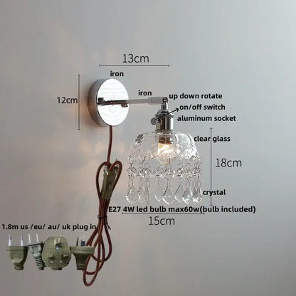 Modern chrome crystal led wall light featuring a polished iron arm with clear glass shade and dangling crystal teardrops