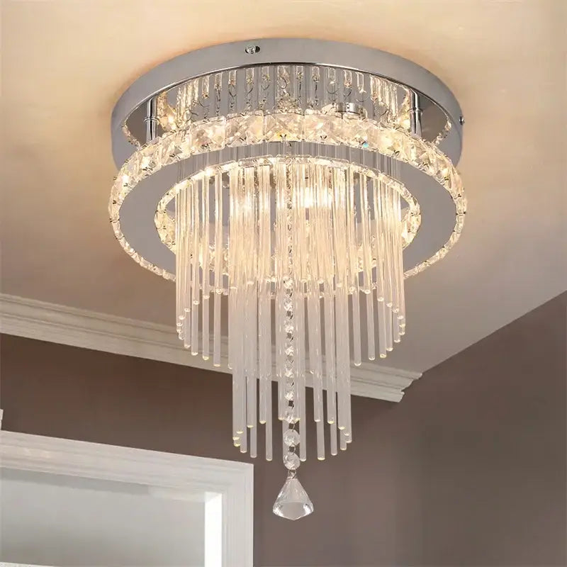Modern chrome crystal raindrop chandelier with clear glass prisms and faceted crystals ceiling light for dining room decorbites