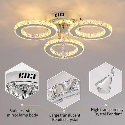 Modern chrome crystal raindrop chandelier ceiling light with gold-toned interlocking rings and dangling high transparency crystal pendant