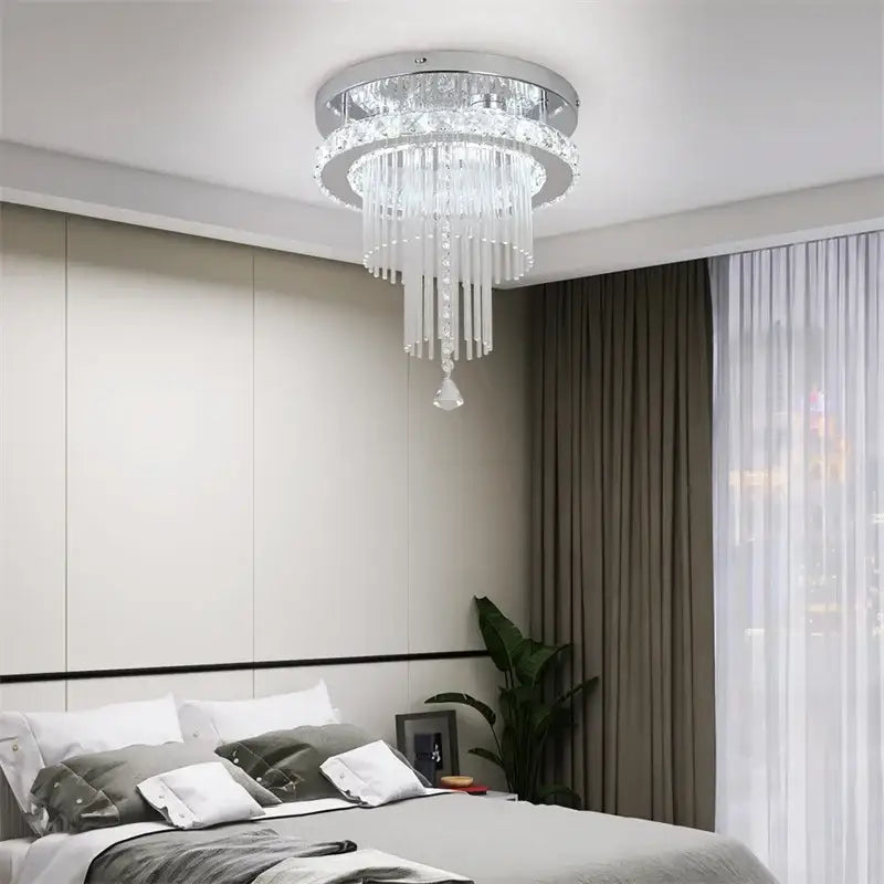 Modern chrome crystal raindrop chandelier with clear glass prisms and sleek frame ceiling light for dining room decorbites crystal raindrop