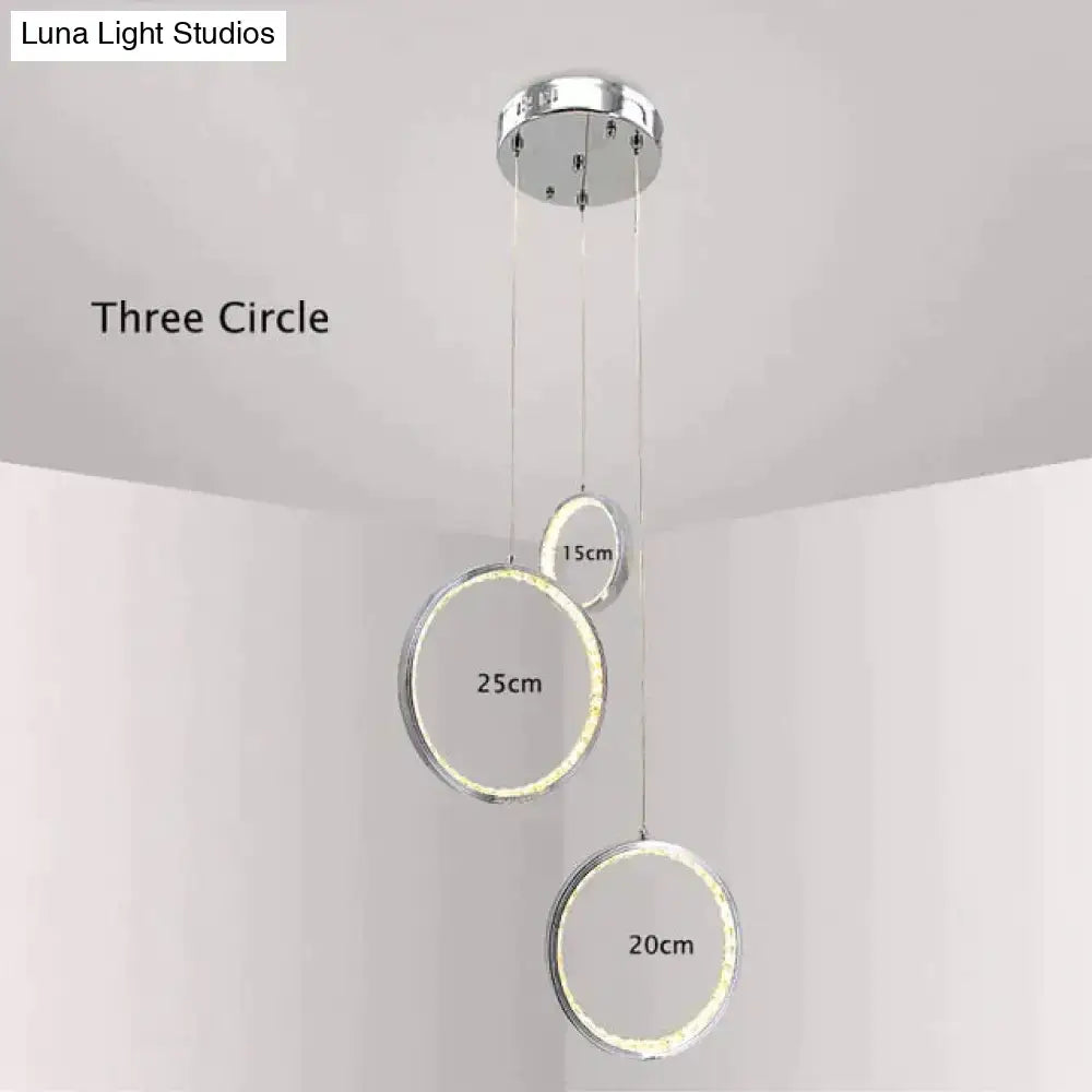 Modern chrome-finished decorbites crystal rings pendant light with led rings emitting soft white glow for indoor use