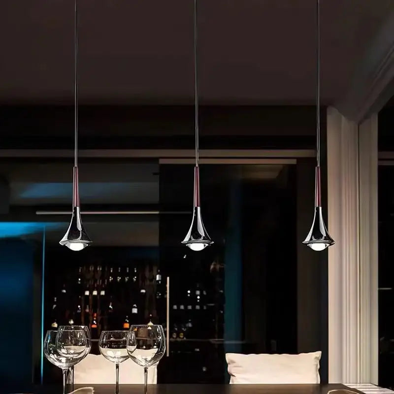 Three chrome-finished conical pendant lights with dark cords from decorbites led studio rain staircase chandelier bar light