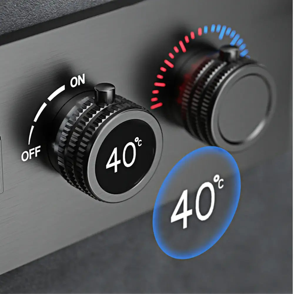 Black temperature control knobs with red and blue LED indicators on a brushed metal panel of a modern chrome digital rainfall shower system
