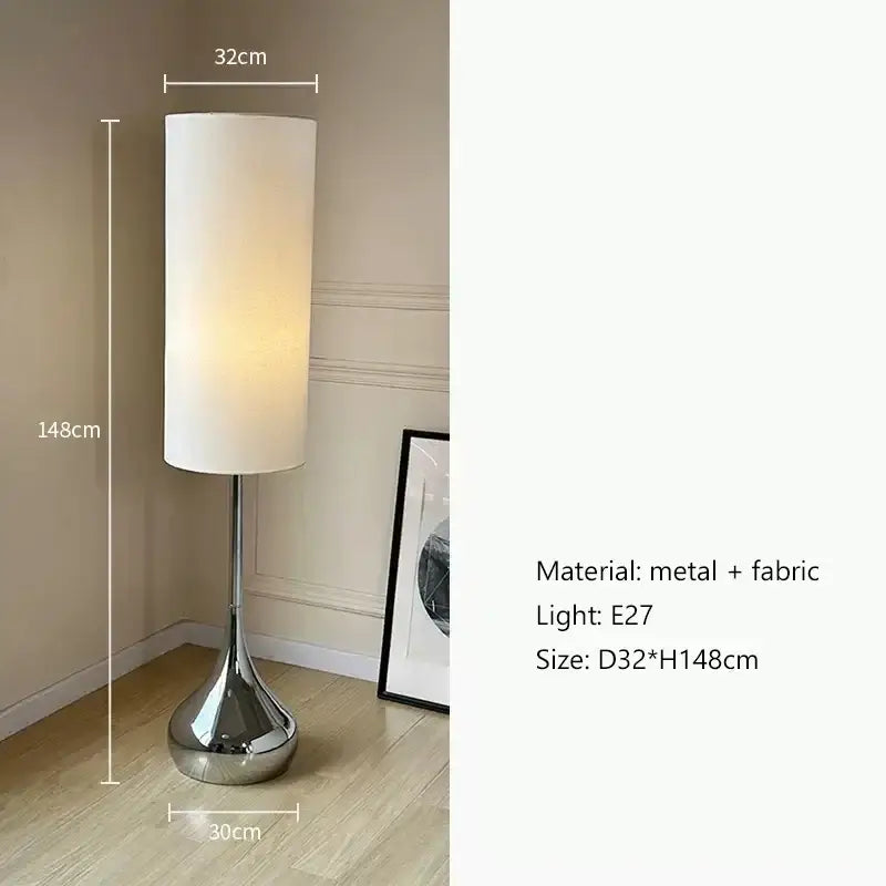 A modern floor lamp with a polished chrome base and decorbites cream fabric shade for stylish living room lighting