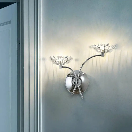 Modern chrome flower wall lamp with two crystal-accented arms, suitable as a 110v-120v bedroom wall light