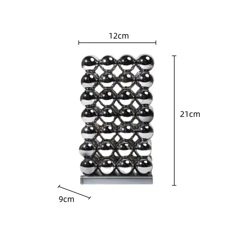 A modern chrome geometric crystal ball sculpture made of polished spheres in a 12cm by 21cm grid pattern
