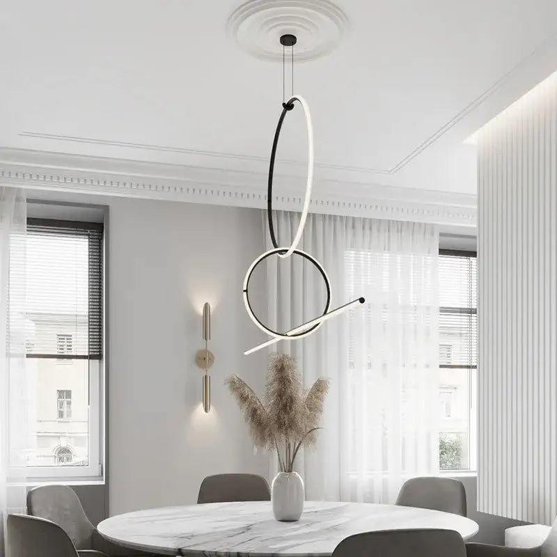 Modern chrome geometric led pendant light with sleek black and white circular design for dining room decorbites geometric led