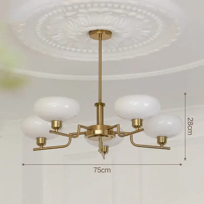 Gold-toned ball pendant chandelier with five frosted white glass shades for bedroom decorbites glass ball pendant