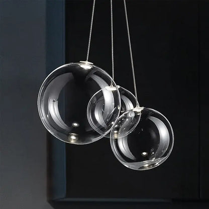 Modern chrome glass ball pendant light featuring clear spherical glass pendant light ideal for dining room decorbites glass ball